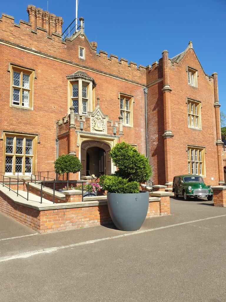 Exterior of Latimer house with a beautiful blue sky