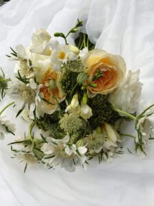 bouquet of white flowers on a white table cloth